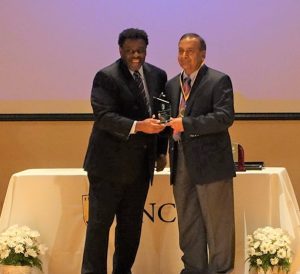 Sat Gupta receiving UNCG Senior Research Excellence Award from Chancellor Gilliam